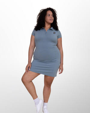 This image showcases the Lakes and Grapes Slate Blue Active Golf Dress. It features a comfortable and flexible fit, perfect for a day on the golf course or out on the town.