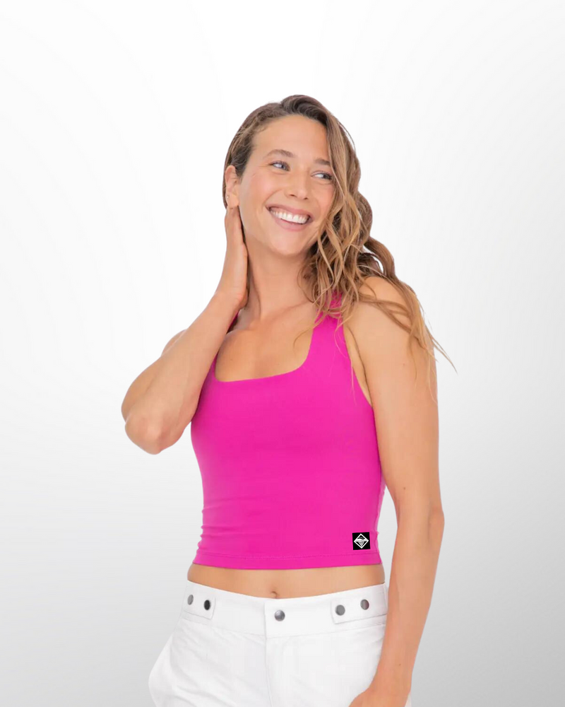 The Hera Racerback Active top in hot pink is designed for active wear and fitness activities. It features a stylish and functional racerback design, which provides freedom of movement for the arms and shoulders.