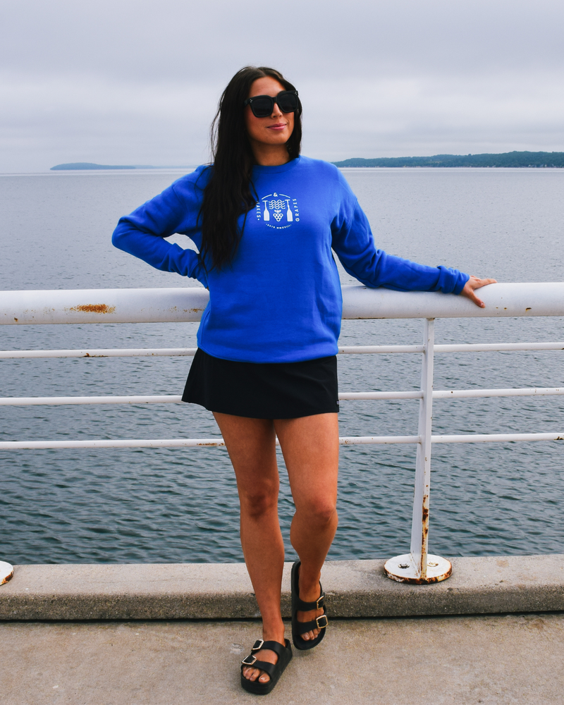 The image shows a Lifestyle Crew Sweatshirt in a deep royal blue color. The sweatshirt appears soft and comfortable, made from a cozy fabric.