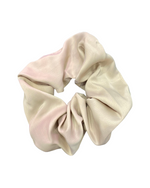 The image displays a Satin Hair Scrunchie, a luxurious and practical hair accessory. Its texture is soft to the touch, providing gentle support for hair without causing breakage or pulling.