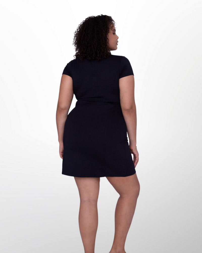 This image showcases the Lakes and Grapes Black Active Golf Dress. It features a comfortable and flexible fit, perfect for a day on the golf course or out on the town.