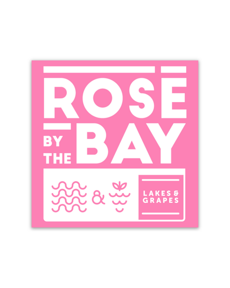 The image features the "Rosé by the Bay" Pink Sticker, a delightful and charming design. A perfect addition to various items, adding a touch of elegance and sophistication to your belongings.