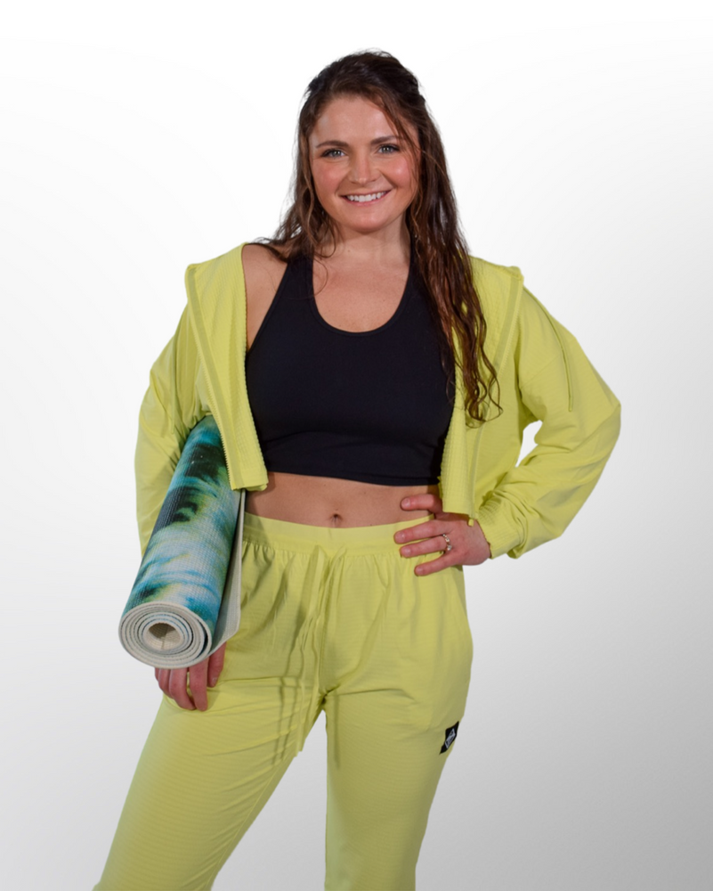 This image showcases the Lakes and Grapes Active Racerback Bra Top paired with our Active Textured Cropped Jacket and Joggers, a stylish and practical activewear piece. The top is designed with a racerback style, providing support and flexibility during physical activities.