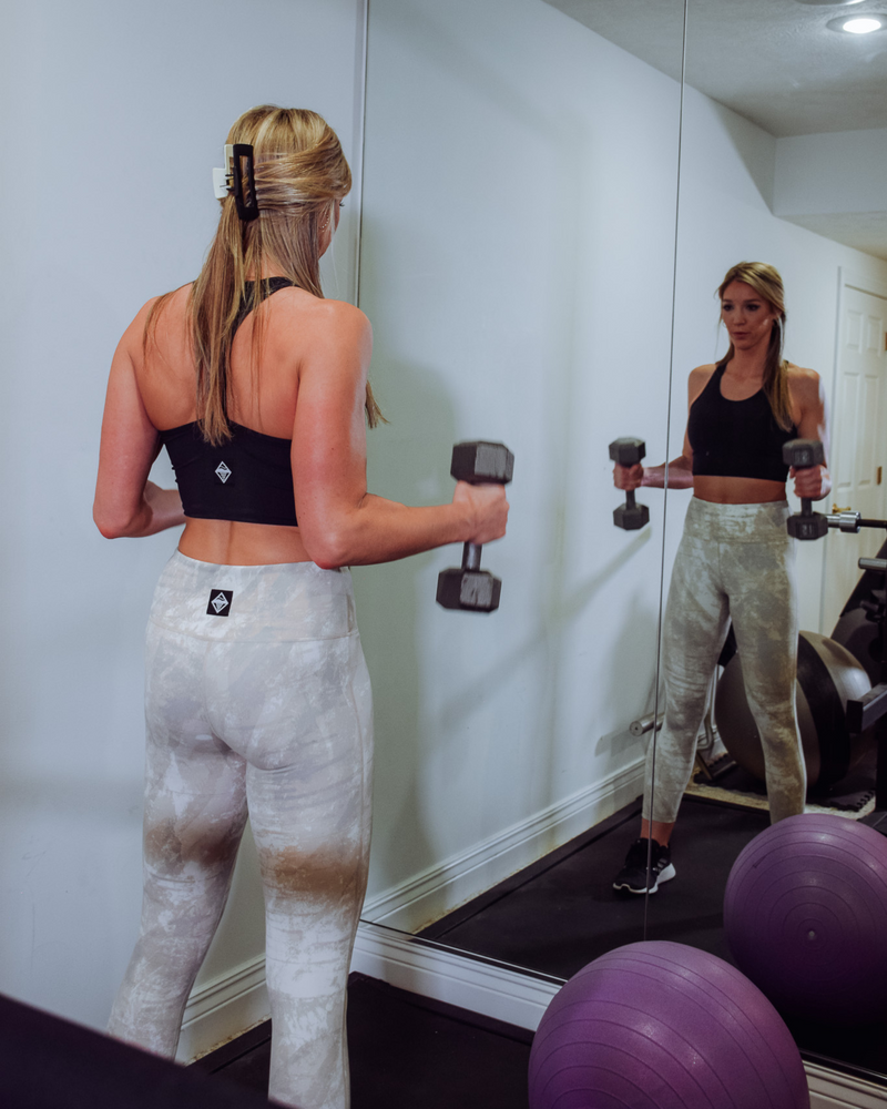 The image displays a Tie Dye Active High-Waist Legging, a trendy and comfortable activewear bottom. The fabric is stretchy and breathable, allowing for ease of movement during workouts or daily activities.