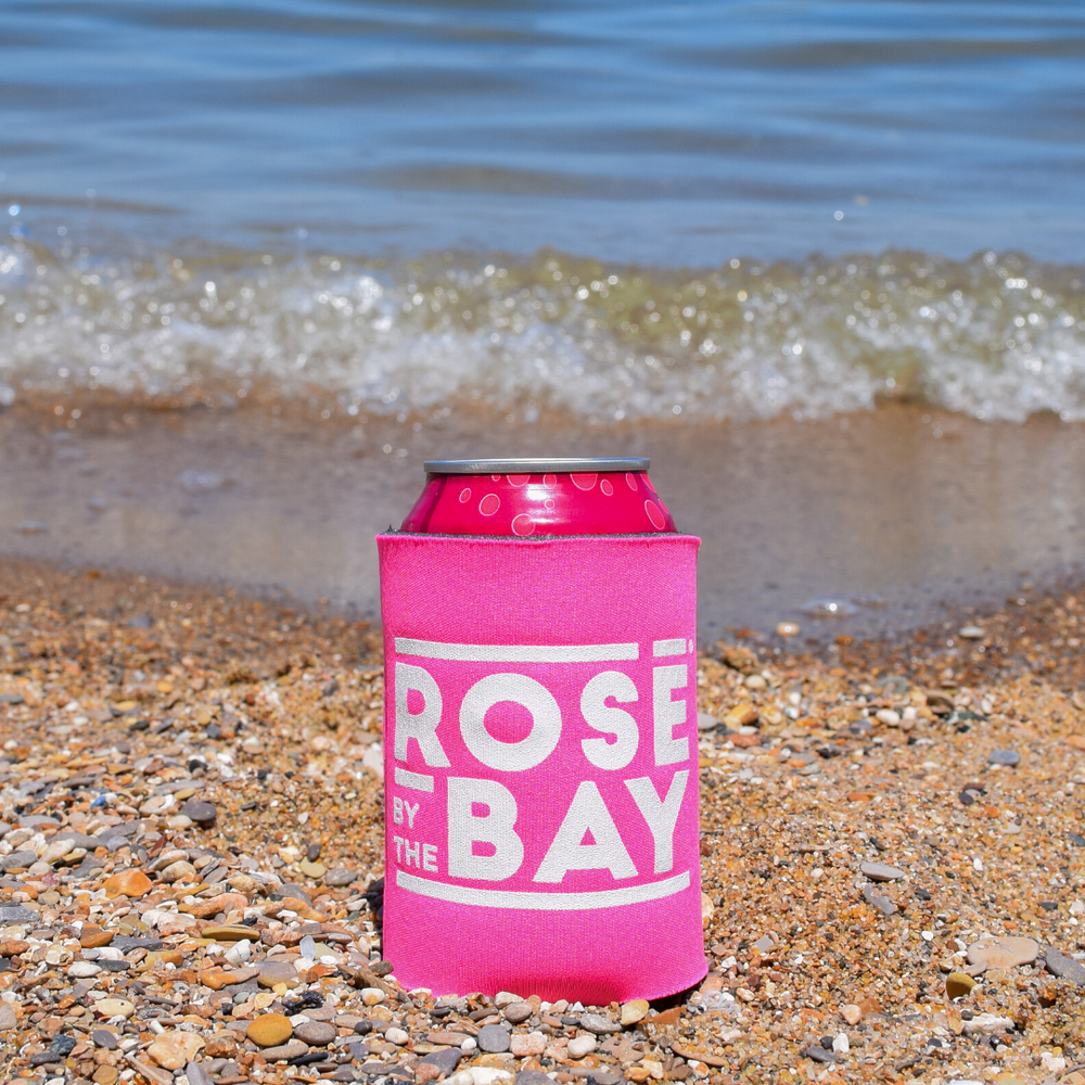 Rosé by the Bay Koozie keeping all of your drinks cold on your beach day in Traverse City