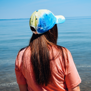 View of the back design on the Tie Dye Hat in downtown Traverse City