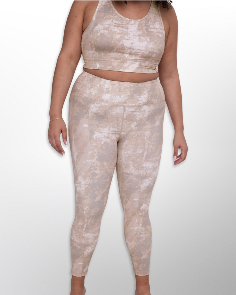 The image displays a Tie Dye Active High-Waist Legging, a trendy and comfortable activewear bottom. The fabric is stretchy and breathable, allowing for ease of movement during workouts or daily activities.