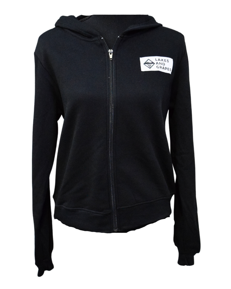 The image showcases The Label Women's Zip, a versatile and stylish clothing item. The jacket is tailored with attention to detail, providing a comfortable and flattering fit.