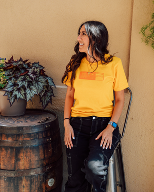 This image presents the Lakes and Grapes Adventure Tee. Whether you're hiking, camping, or simply enjoying the great outdoors, this tee ensures you stay comfortable and stylish.