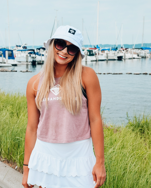 The Women's Classic Cropped Tank is a stylish and comfortable garment designed for versatility and ease. Made from soft, breathable fabric, it provides a cool and comfortable wear, perfect for warm weather.