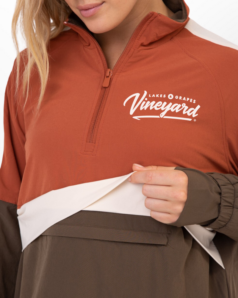 The image shows a Women's Vineyard Active Pullover, a versatile and comfortable athletic wear. The pullover features a lightweight, breathable fabric ideal for active pursuits. It has a crew neckline and long sleeves, providing full coverage and protection.