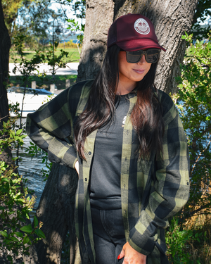 The image features a Summit Flannel, a warm and cozy garment designed for comfort and style. The flannel shirt is made from soft, brushed fabric that provides a gentle texture against the skin.