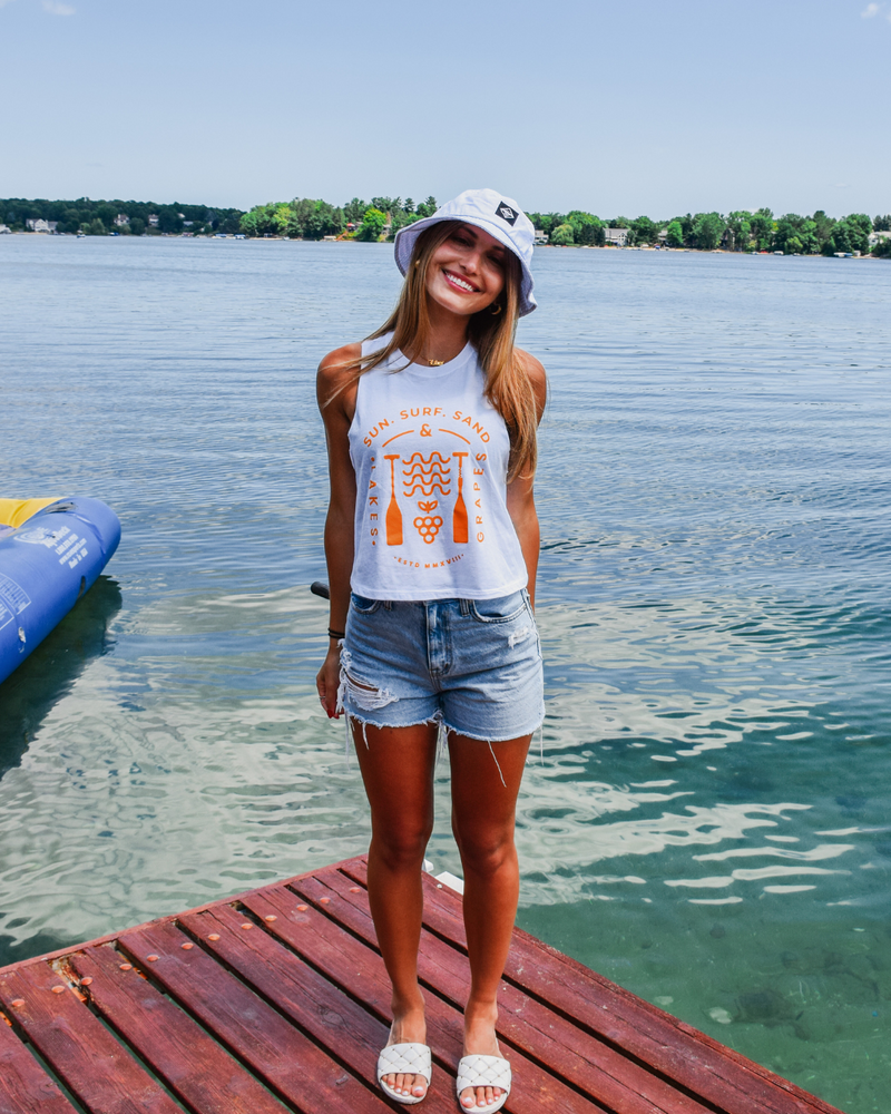 The image displays a Sun Surf Sand Women's Tank, a comfortable and casual sleeveless top. The fabric is soft and breathable, making it perfect for hot days.
