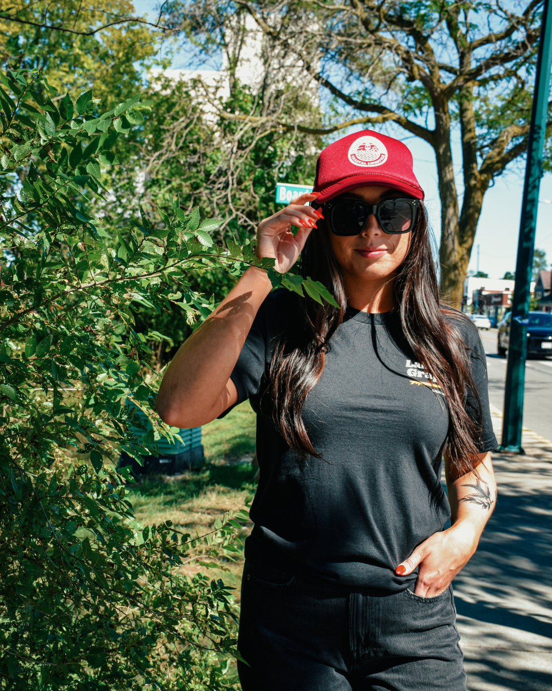 This image depicts the Lakes and Grapes Coastal Lifestyle Trucker Hat. The hat is a classic trucker style with a structured front panel and a gently curved brim. It's a versatile and fashionable accessory suitable for outdoor activities and coastal enthusiasts.