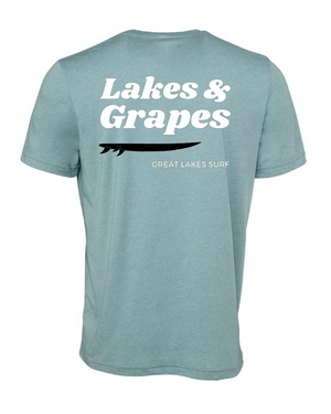 
            
                Load image into Gallery viewer, This image features a Lakes and Grapes Great Lakes Surf Tee. Crafted for those who can&amp;#39;t get enough of the water, this tee captures that lake-life spirit effortlessly.
            
        