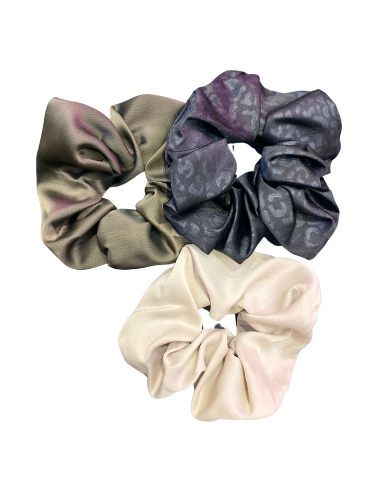
            
                Load image into Gallery viewer, The image displays a Satin Hair Scrunchie, a luxurious and practical hair accessory. Its texture is soft to the touch, providing gentle support for hair without causing breakage or pulling.
            
        