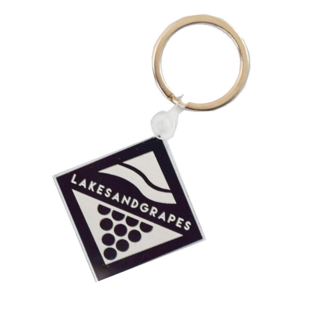 Lakes and Grapes black and white logo keychain.