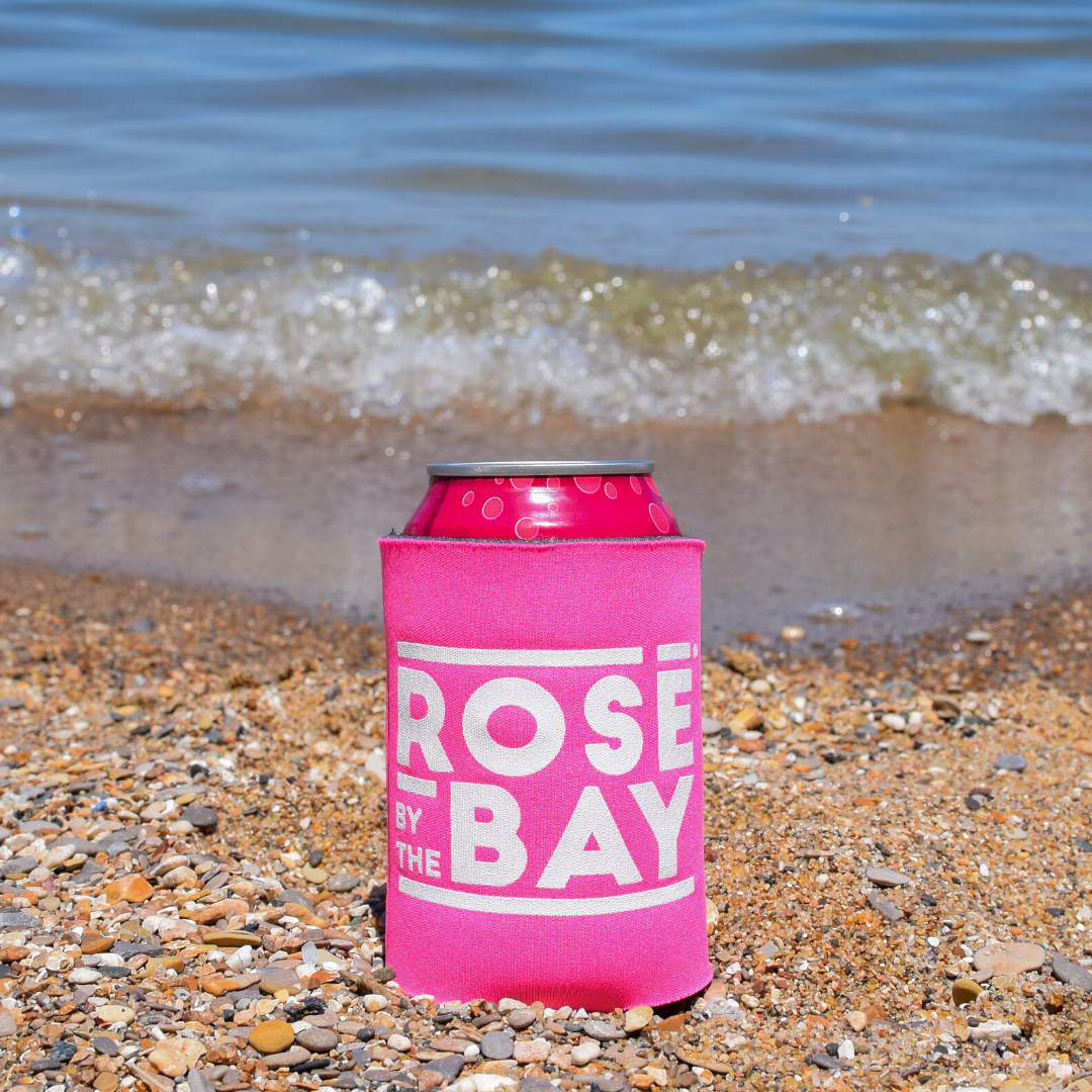 Rosé by the Bay Koozie keeping all of your drinks cold on your beach day in Traverse City