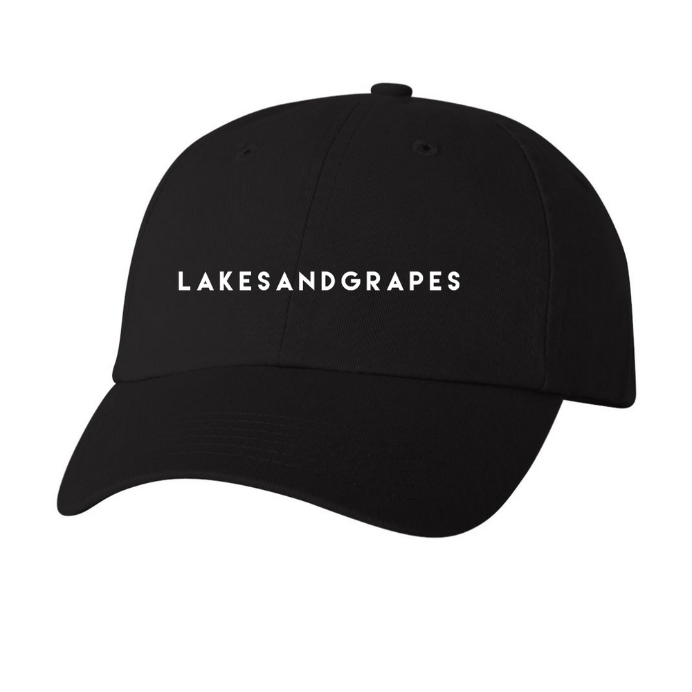 
            
                Load image into Gallery viewer, Lightweight and breathable, our classic black cap is the perfect accessory to rep Lakes and Grapes.
            
        