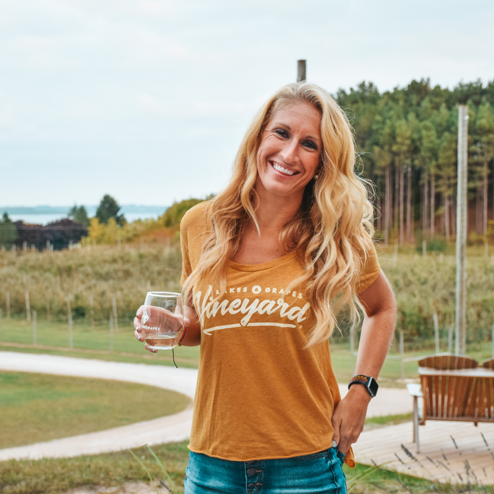 
            
                Load image into Gallery viewer, Wine Taste in Traverse City and wear the Women&amp;#39;s Vineyard Scoop Tee- Gold by Lakes and Grapes
            
        