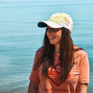Summertime in Traverse City and wearing the Lakes and Grapes Tie Dye Hat- Sunset