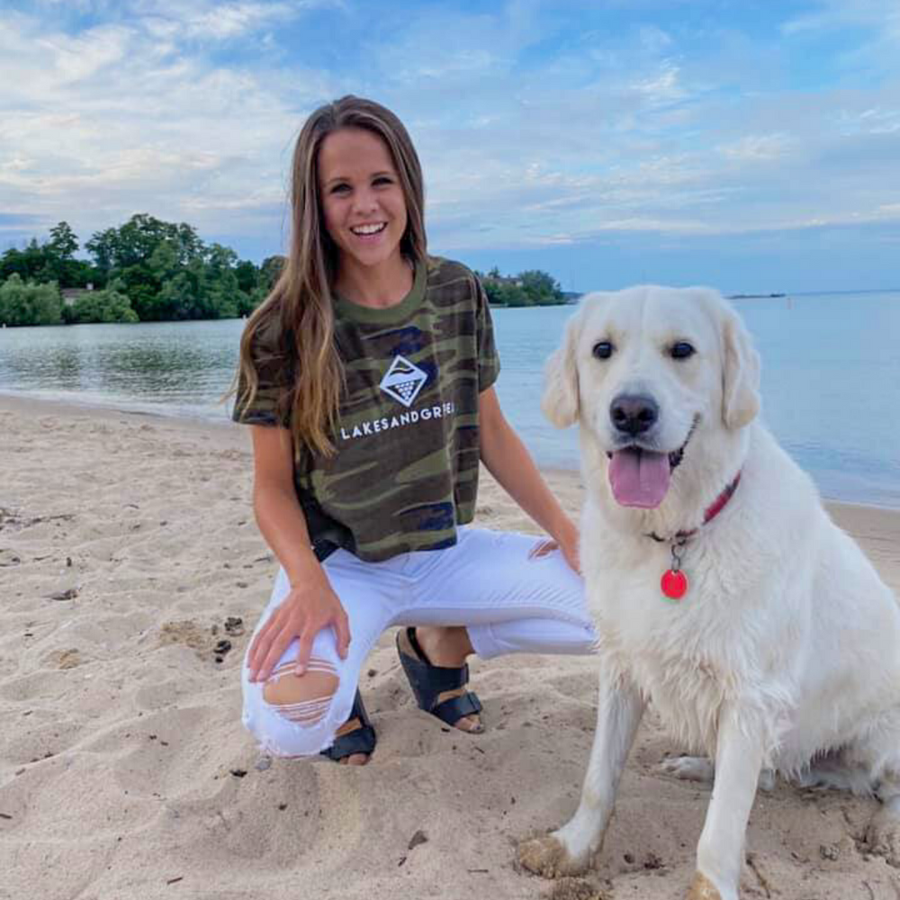 
            
                Load image into Gallery viewer, Walk the beach in Traverse City while wearing the Lakes and Grapes Women&amp;#39;s Classic Camo Crop Tee
            
        