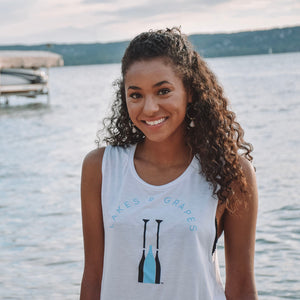 
            
                Load image into Gallery viewer, Lakes and Grapes paddle tank in white with blue and black print is perfect for at the winery and at dinner. You&amp;#39;ll be comfortable all day in the super soft material.
            
        